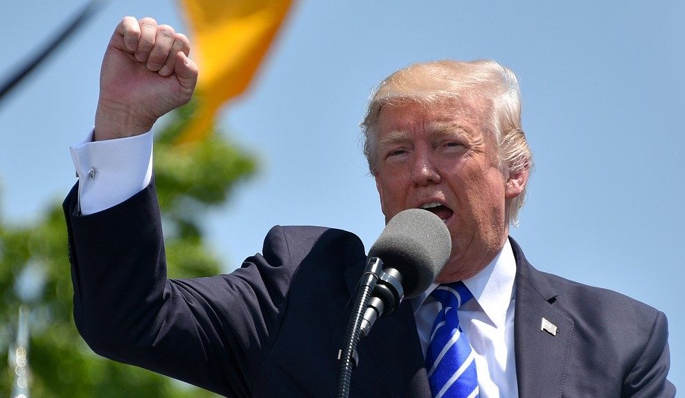 Donald Trump could face serious jail time as a result of the Espionage Act document case indictment, to say nothing of criminal charges still to come. But Trump believes he's exempt and bears no responsibility. Trump defiantly gestures in a speech.