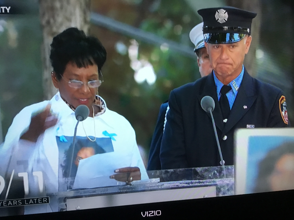 Survivors read the names of the fallen during the 9/11 ceremonies at Ground Zero in NYC 9/11/21
